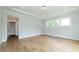 Spacious primary bedroom with hardwood floors and ample natural light at 242 Lakestone Estates, Pittsboro, NC 27312