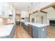 Open concept kitchen with island, farmhouse sink, and high-end finishes at 242 Lakestone Estates, Pittsboro, NC 27312