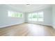 Spacious bedroom with hardwood floors and large windows at 242 Lakestone Estates, Pittsboro, NC 27312