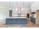 Gourmet kitchen with large island, stainless steel appliances, and white cabinets at 242 Lakestone Estates, Pittsboro, NC 27312