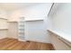 Large walk-in closet with ample shelving and hanging space at 242 Lakestone Estates, Pittsboro, NC 27312