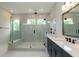 Modern bathroom with a large walk-in shower and double vanity at 242 Lakestone Estates, Pittsboro, NC 27312