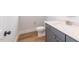 Small powder room with single vanity and toilet at 242 Lakestone Estates, Pittsboro, NC 27312