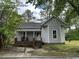 Gray house with red brick foundation and porch at 529 Dexter St, Rocky Mount, NC 27803