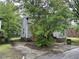 Gray house with red brick foundation and driveway at 529 Dexter St, Rocky Mount, NC 27803