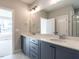 Dual vanity bathroom with modern fixtures and tile flooring at 1713 Grassy Falls Ln, Wendell, NC 27591