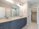 Modern bathroom with double vanity, shower, and walk-in closet at 1713 Grassy Falls Ln, Wendell, NC 27591