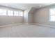 Spacious bedroom with vaulted ceiling, multiple windows, and neutral carpet at 1713 Grassy Falls Ln, Wendell, NC 27591