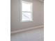 View of window in a bedroom with neutral-colored carpet at 1713 Grassy Falls Ln, Wendell, NC 27591