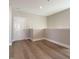 Bonus room with hardwood floors and half wall at 1713 Grassy Falls Ln, Wendell, NC 27591