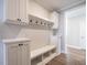 Bright entryway with built-in bench, hooks, and storage cubbies at 1713 Grassy Falls Ln, Wendell, NC 27591