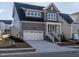 Attractive two-story gray home with white trim and attached garage at 1713 Grassy Falls Ln, Wendell, NC 27591