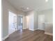 Hallway with wood-style flooring and access to adjacent rooms at 1713 Grassy Falls Ln, Wendell, NC 27591