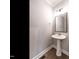 Powder room with pedestal sink and modern fixtures at 1713 Grassy Falls Ln, Wendell, NC 27591