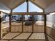 Screened porch with wood decking, wood railings, and views of the neighborhood at 1713 Grassy Falls Ln, Wendell, NC 27591