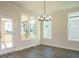 Bright dining room with hardwood floors and access to a screened porch at 1719 Grassy Falls Ln, Wendell, NC 27591