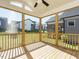 Relaxing screened porch with wooden deck and backyard views at 1719 Grassy Falls Ln, Wendell, NC 27591