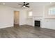 Living room with hardwood floors, fireplace, and built-in cabinets at 1719 Grassy Falls Ln, Wendell, NC 27591