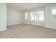 Spacious bedroom with large windows and neutral decor at 1719 Grassy Falls Ln, Wendell, NC 27591