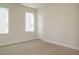 Well-lit bedroom featuring neutral walls and carpet at 1719 Grassy Falls Ln, Wendell, NC 27591