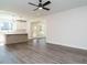 Open concept living area with kitchen views and hardwood floors at 1719 Grassy Falls Ln, Wendell, NC 27591