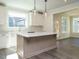 Modern kitchen with white cabinets, a large island and stainless steel appliances at 1719 Grassy Falls Ln, Wendell, NC 27591