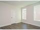 Spacious bedroom with hardwood floors and neutral walls at 1719 Grassy Falls Ln, Wendell, NC 27591