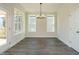 Bright dining room with hardwood floors and a chandelier at 1719 Grassy Falls Ln, Wendell, NC 27591