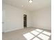 Bright bedroom with plush carpeting and an en-suite bathroom at 1719 Grassy Falls Ln, Wendell, NC 27591