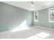 Bright bedroom with light walls, plush carpeting and ceiling fan at 1113 Destination Dr, Apex, NC 27523
