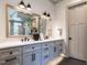 Double vanity bathroom with a large mirror and plenty of storage at 1113 Destination Dr, Apex, NC 27523