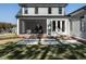 Screened porch with brick patio and grassy backyard at 1113 Destination Dr, Apex, NC 27523