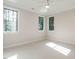 Well-lit bedroom with neutral walls, carpet, and ceiling fan at 1113 Destination Dr, Apex, NC 27523