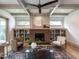 Bright living room with a brick fireplace and coffered ceiling at 1113 Destination Dr, Apex, NC 27523