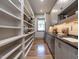 Well-organized pantry with floor-to-ceiling shelving at 1113 Destination Dr, Apex, NC 27523