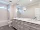 Bathroom with double vanity, large mirror, and a tub at 1113 Destination Dr, Apex, NC 27523