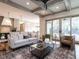 Open living room with a view into the kitchen and access to the backyard at 1113 Destination Dr, Apex, NC 27523