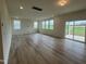 Spacious living room with hardwood floors and sliding glass doors to backyard at 260 Chestnut Oak Ln, Lillington, NC 27546