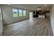 Spacious living room with hardwood floors and kitchen view at 260 Chestnut Oak Ln, Lillington, NC 27546