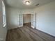 Bright bedroom with hardwood floors and French doors at 260 Chestnut Oak Ln, Lillington, NC 27546
