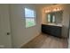 Modern bathroom with double vanity and grey cabinets at 260 Chestnut Oak Ln, Lillington, NC 27546