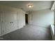Spacious bedroom with double door closet and grey carpet at 260 Chestnut Oak Ln, Lillington, NC 27546