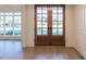 Bright entryway with hardwood floors and double doors at 4800 Latimer Rd, Raleigh, NC 27609