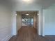 Bright foyer with hardwood floors leading to the living room at 4800 Latimer Rd, Raleigh, NC 27609