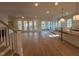 Open living space with hardwood floors and access to a screened porch at 4800 Latimer Rd, Raleigh, NC 27609