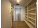 Light-filled hallway with built-in shelving and double doors at 4800 Latimer Rd, Raleigh, NC 27609