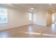 Bright bedroom with hardwood floors and access to hallway at 4800 Latimer Rd, Raleigh, NC 27609