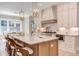 Bright kitchen with an eat-in area and white cabinets at 40 Harvest View Way, Franklinton, NC 27525