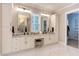 Elegant bathroom with double vanity, marble floors, and large mirrors at 40 Harvest View Way, Franklinton, NC 27525