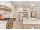 Well-equipped kitchen with a large island and stainless steel appliances at 40 Harvest View Way, Franklinton, NC 27525